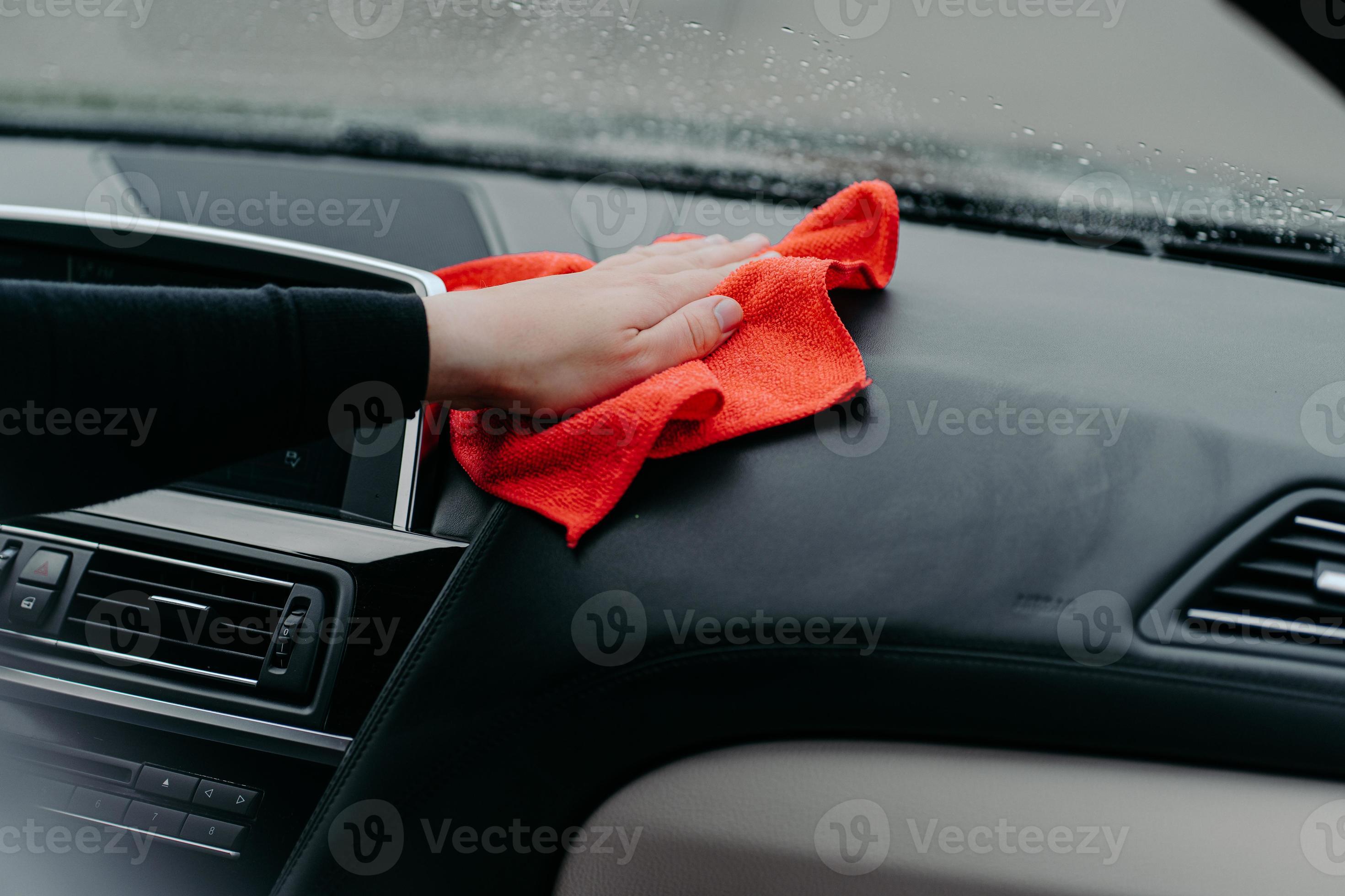 Professional cleaner and car cleaning concept. Unrecognizable man cleans  car interior with cloth. Selective focus. Washing auto dashboard with rag  10373478 Stock Photo at Vecteezy