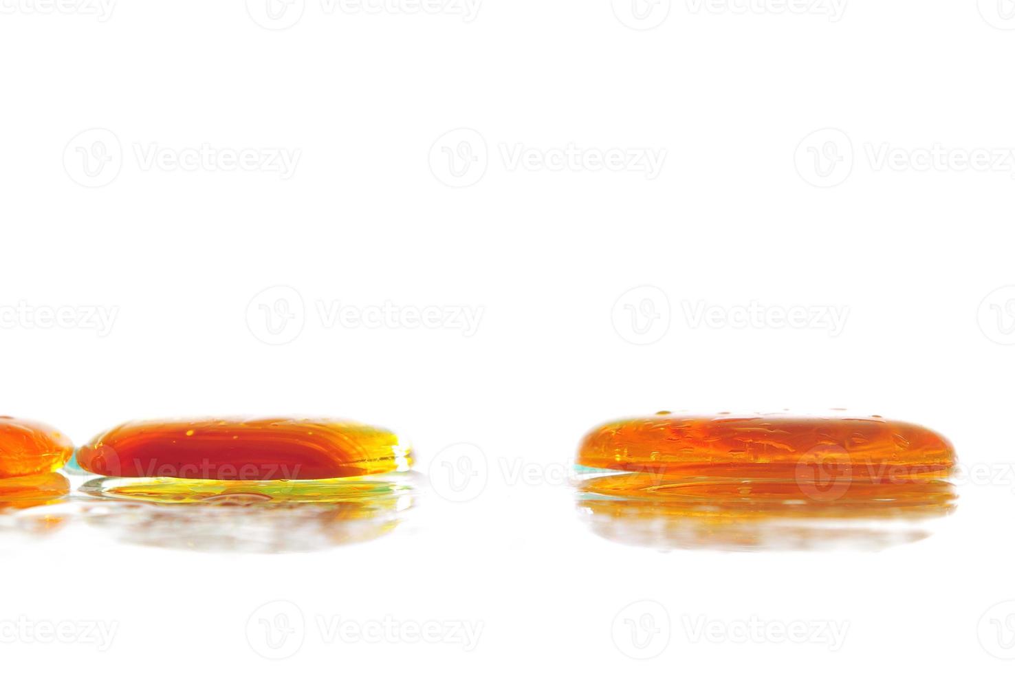 isolated wet zen stones with splashing  water drops photo