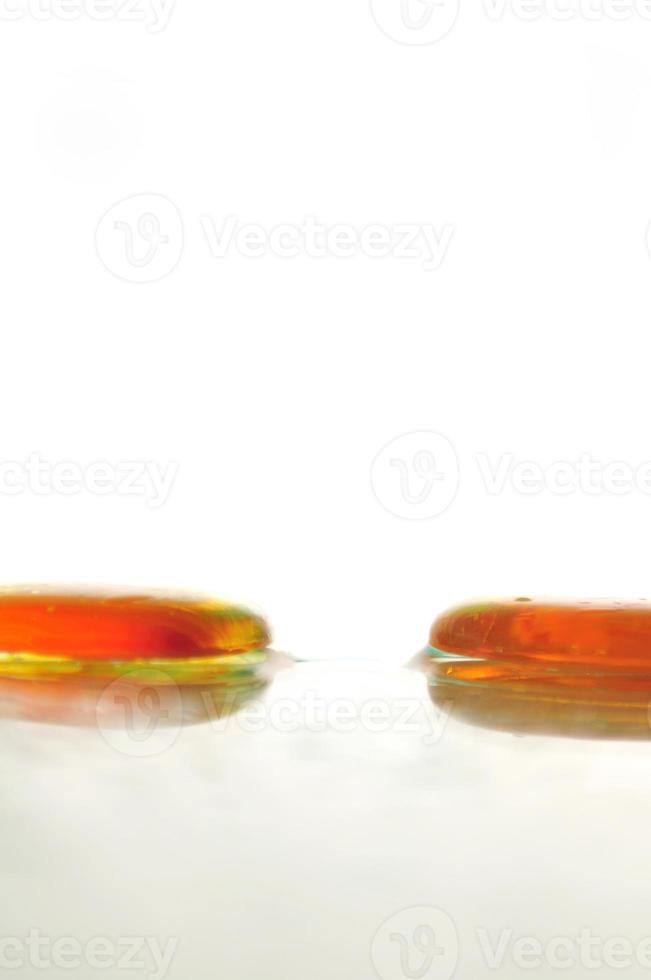 isolated wet zen stones with splashing  water drops photo