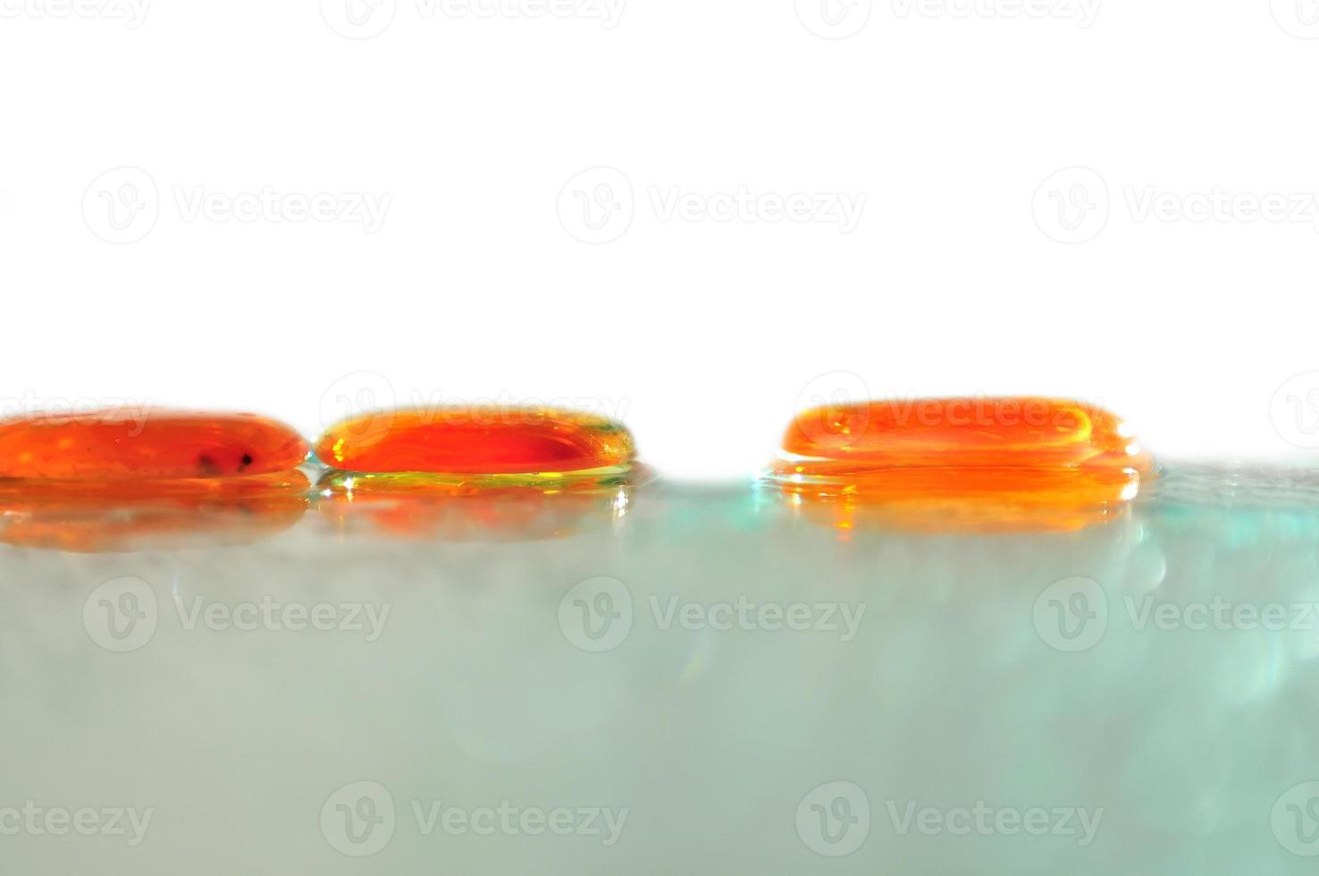 isolated wet zen stones with splashing  water drops photo