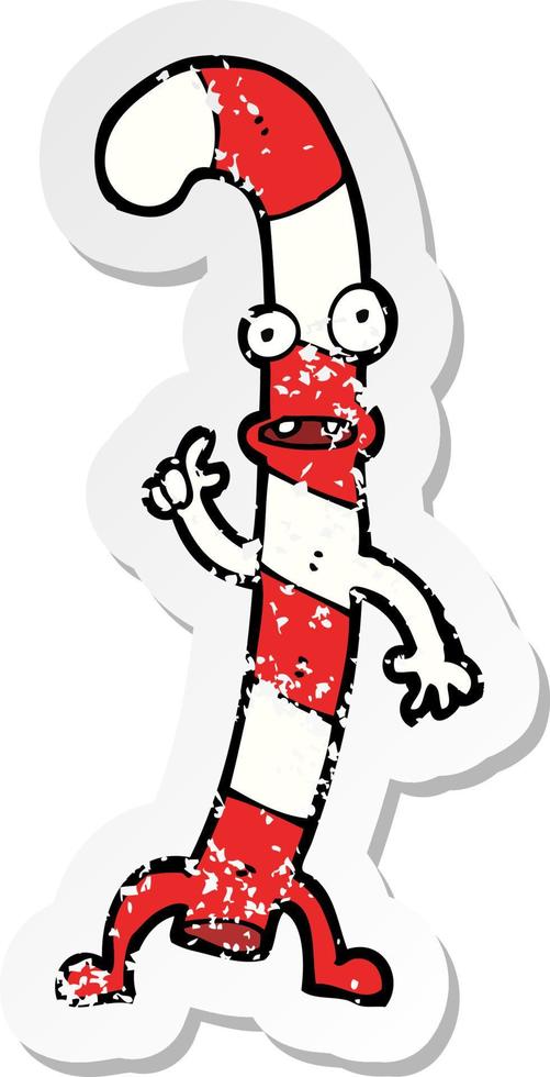 retro distressed sticker of a cartoon dancing christmas candy cane vector