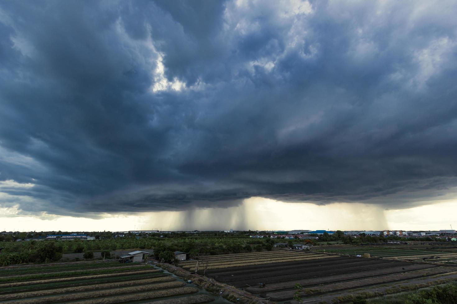 The dark sky with heavy clouds converging and a violent storm before the rain. photo