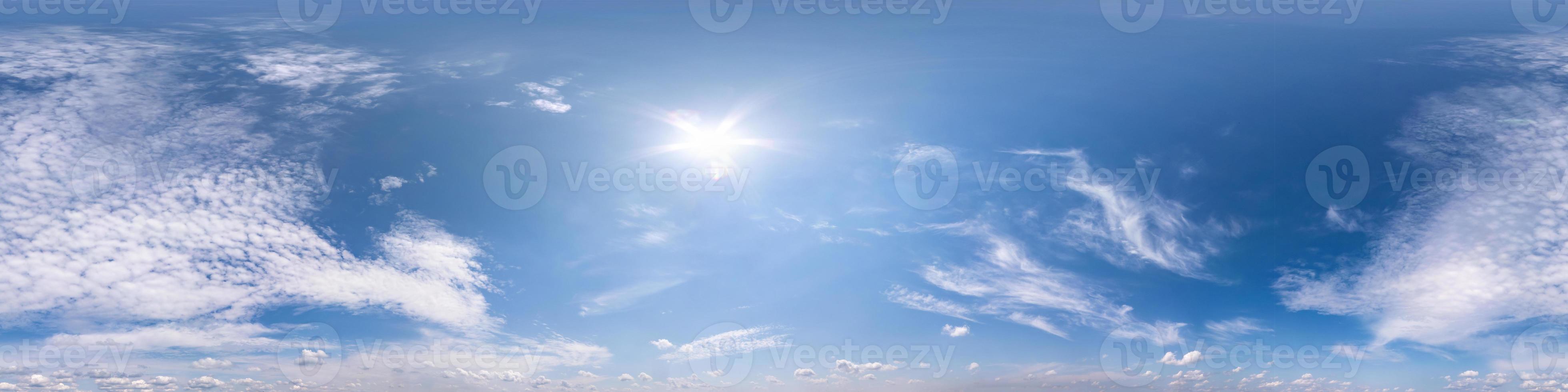 blue clear sky with beautiful fluffy clouds without ground. Seamless hdri panorama 360 degrees angle view without ground for use in 3d graphics or game development as sky dome or edit drone shot photo