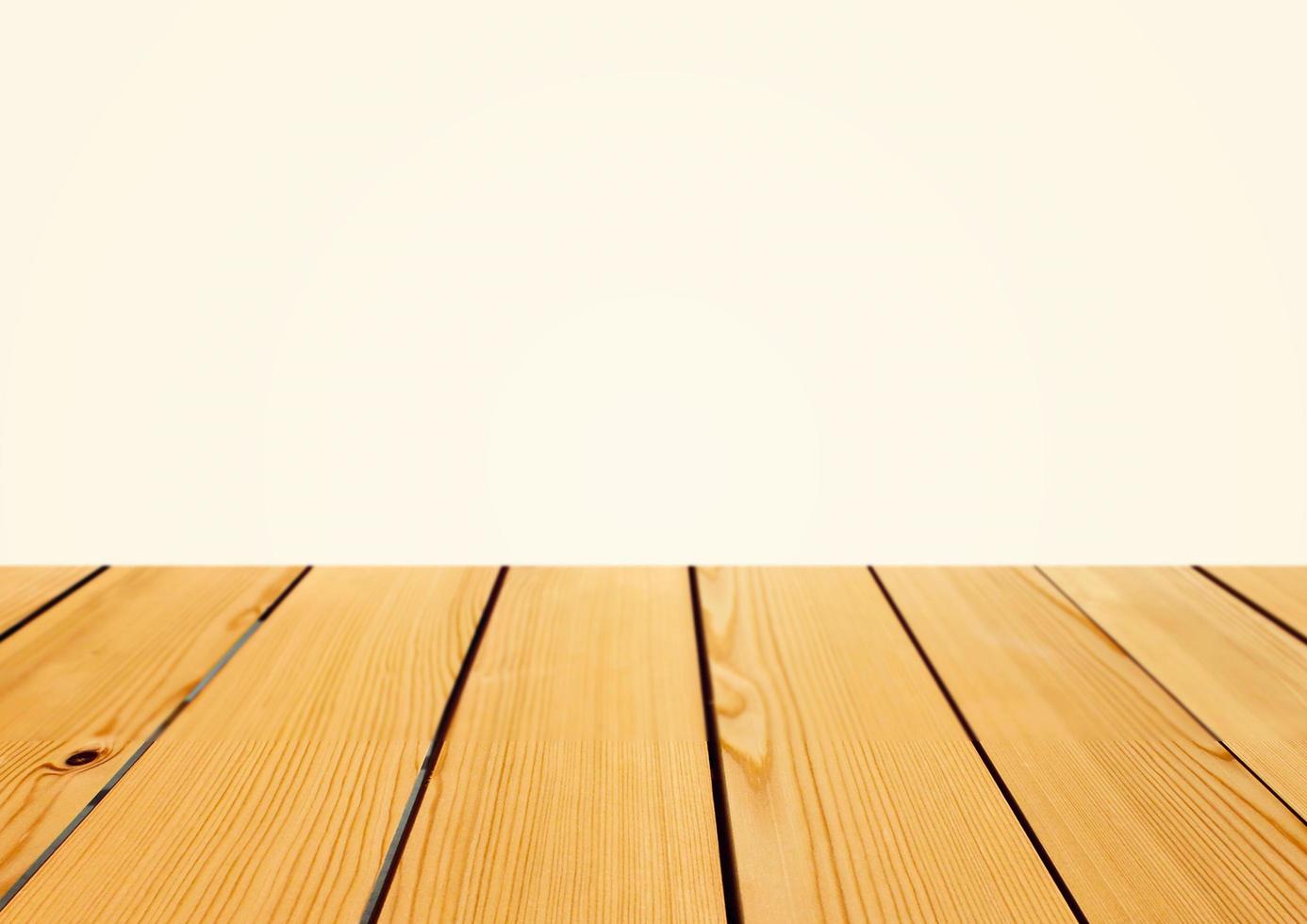 Empty wooden table top for product placement with white background photo