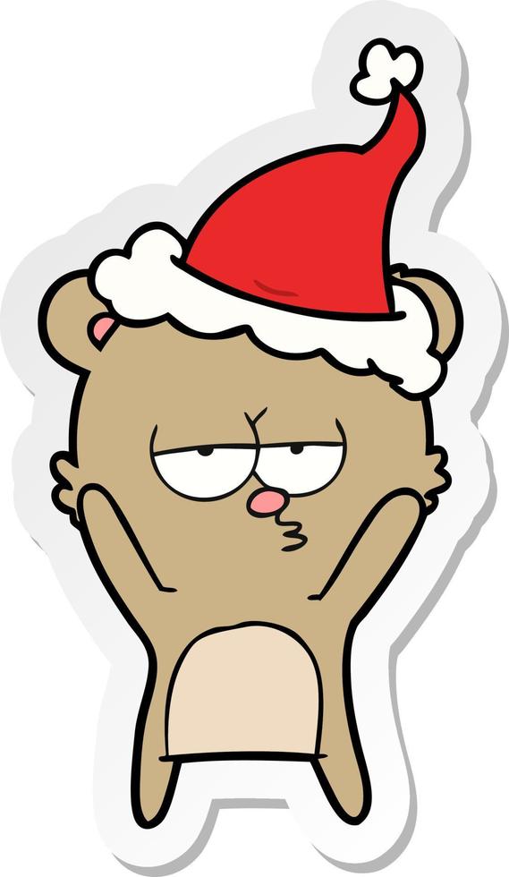 bored bear sticker cartoon of a wearing santa hat vector