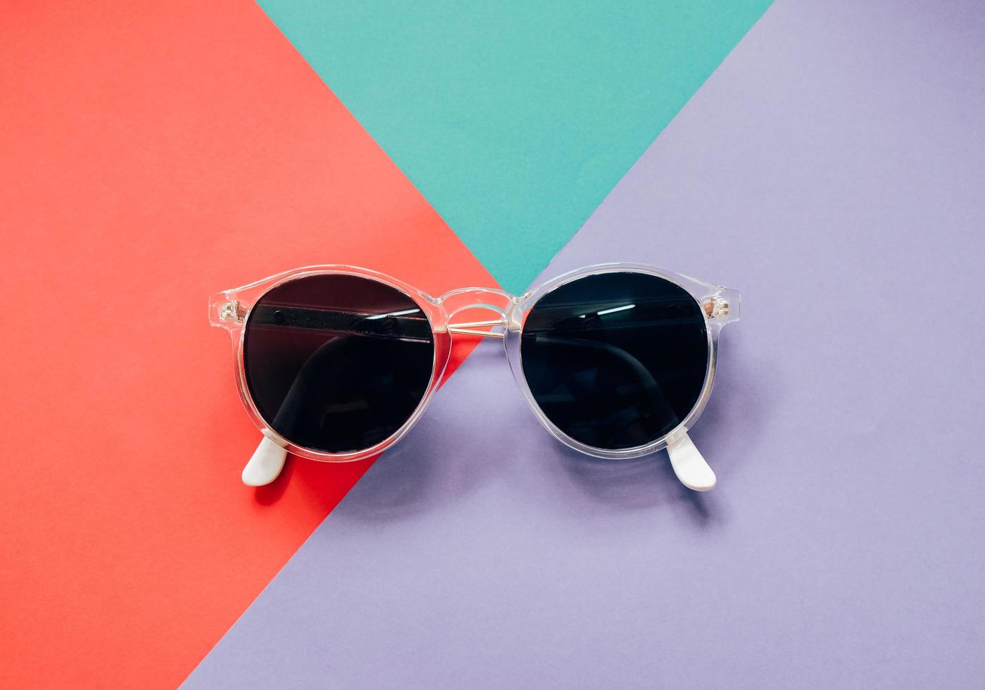 Fashionable sunglasses on minimal colorful background photo