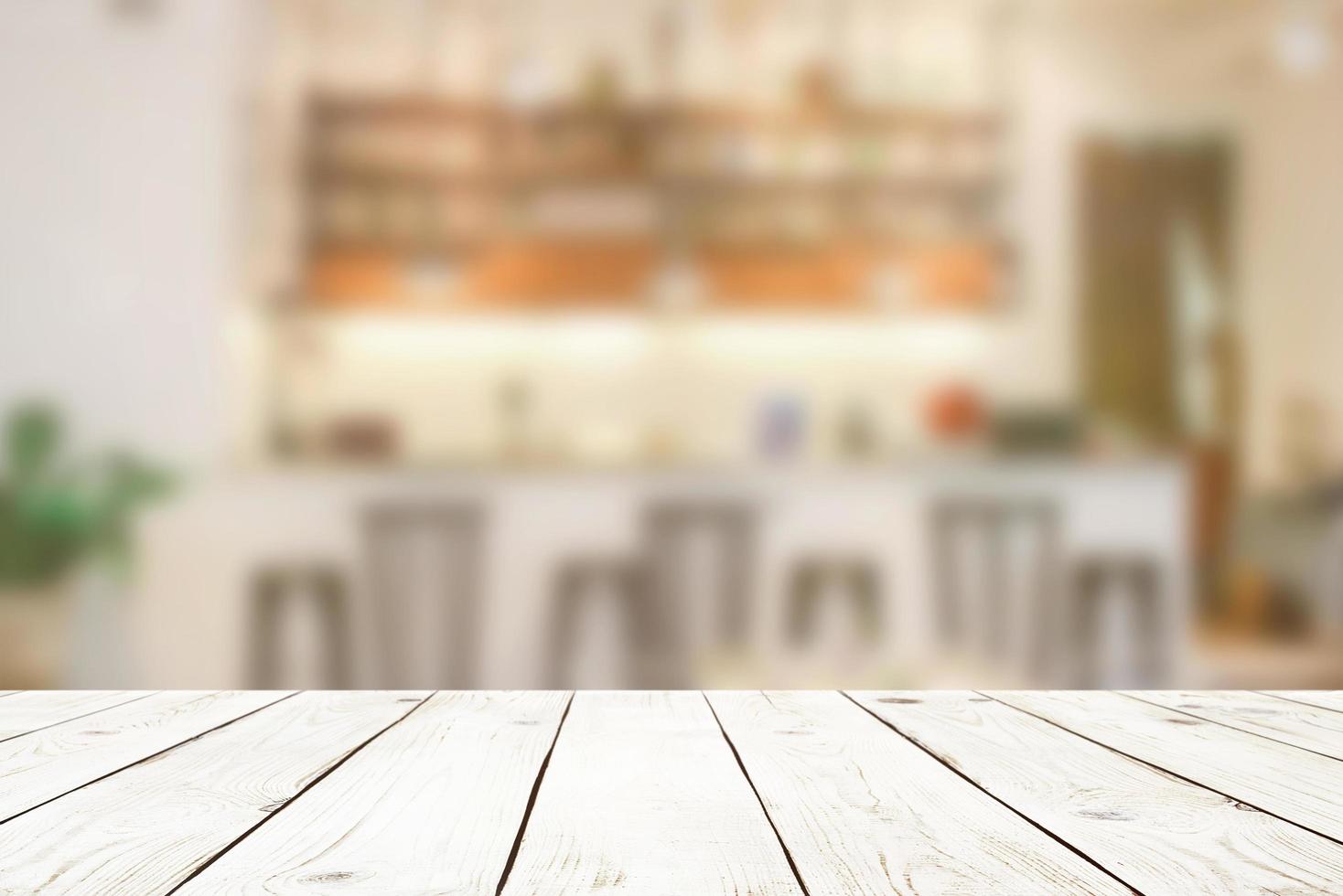 Empty wood table top on blur abstract of cafe or bar background, for montage product display photo