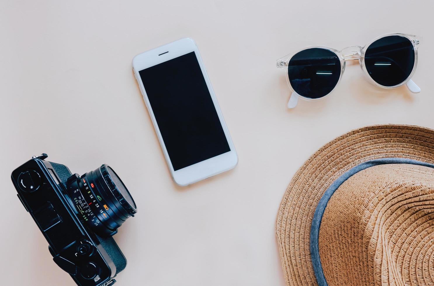 Flat lay of travel items and accessories in minimal style photo