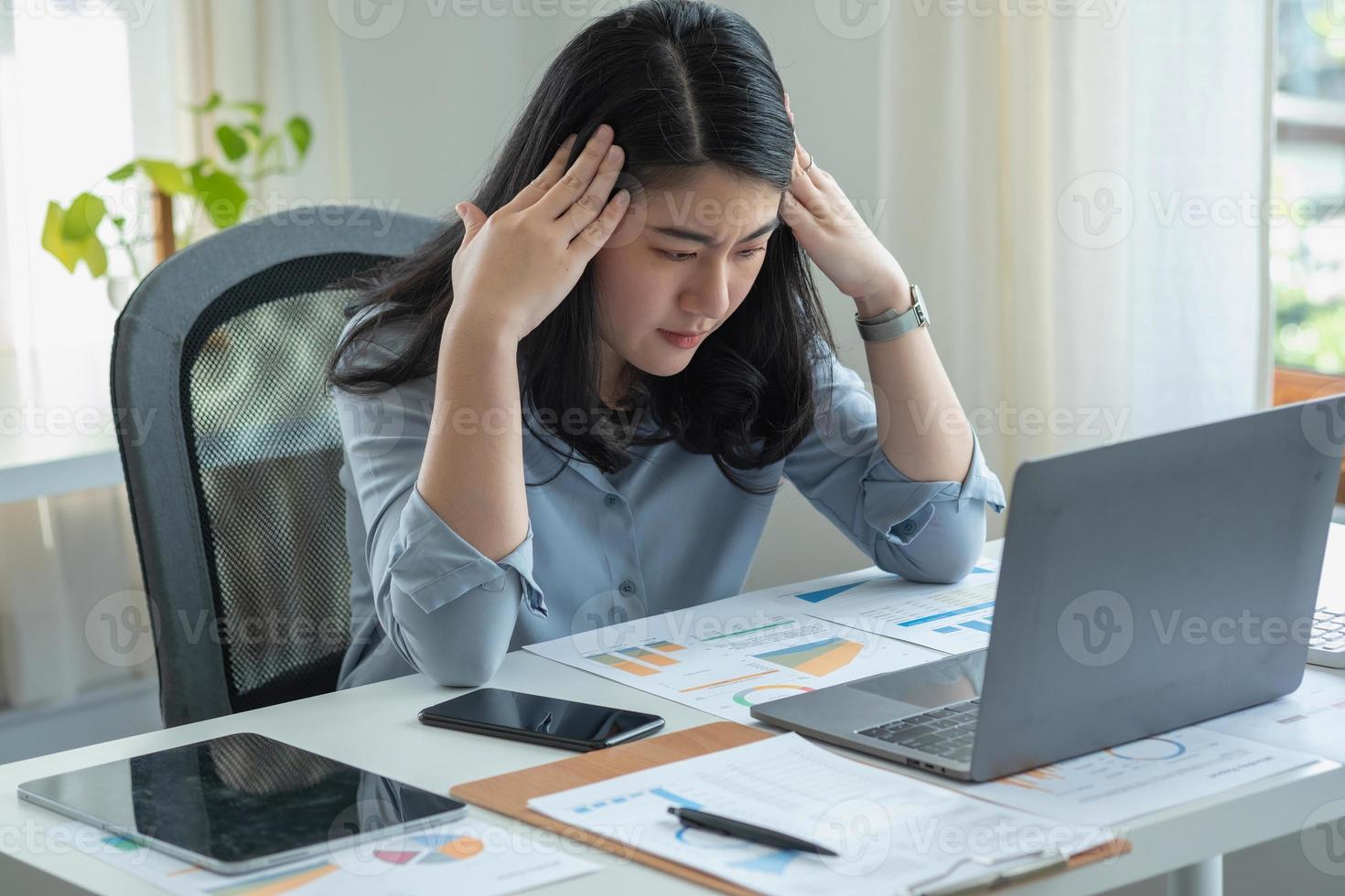 Concept Burnout Syndrome. Business Woman feels uncomfortable working. Which is caused by stress, accumulated from unsuccessful work And less resting body. Consult a specialist psychiatrist. photo