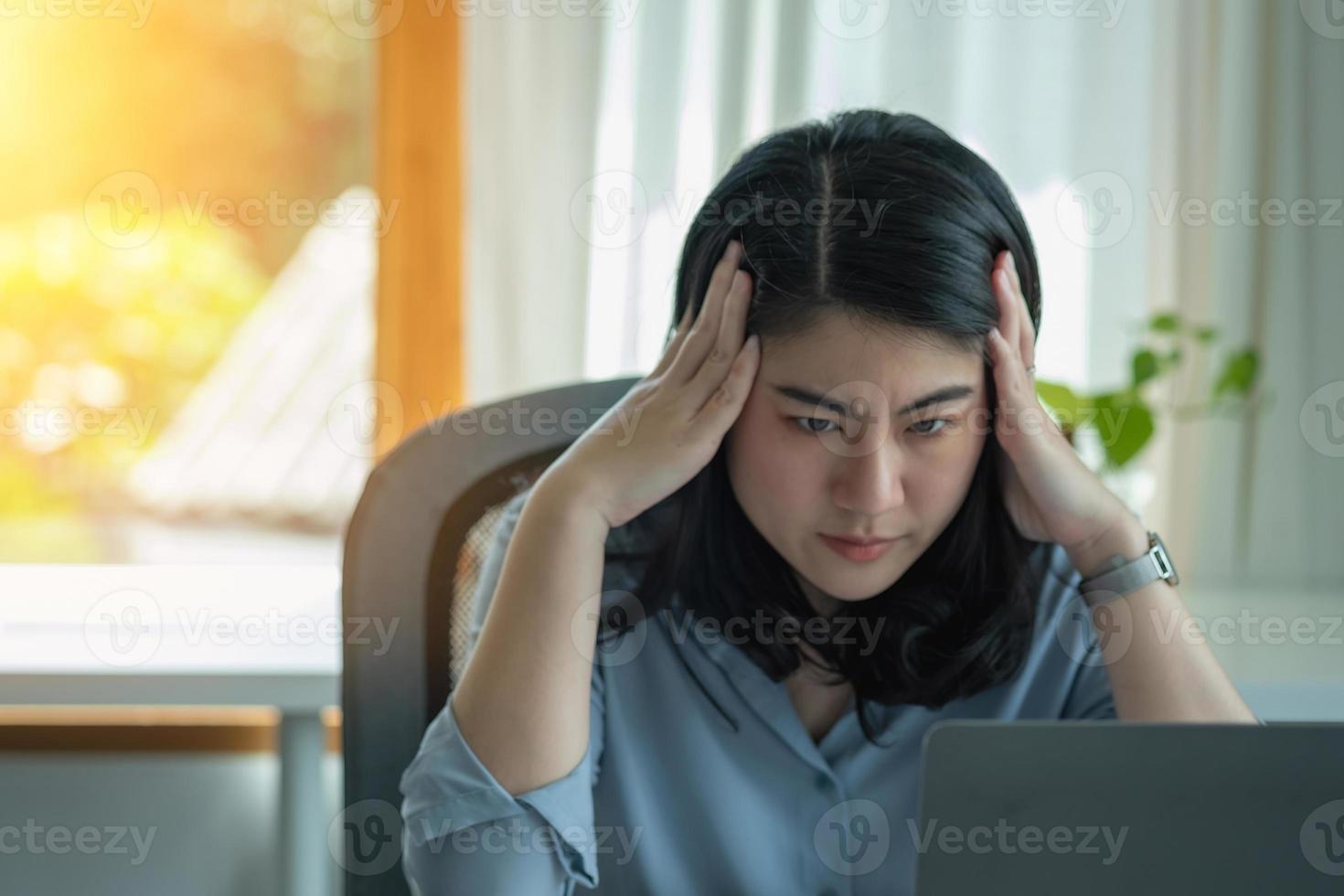 Concept Burnout Syndrome. Business Woman feels uncomfortable working. Which is caused by stress, accumulated from unsuccessful work And less resting body. Consult a specialist psychiatrist. photo