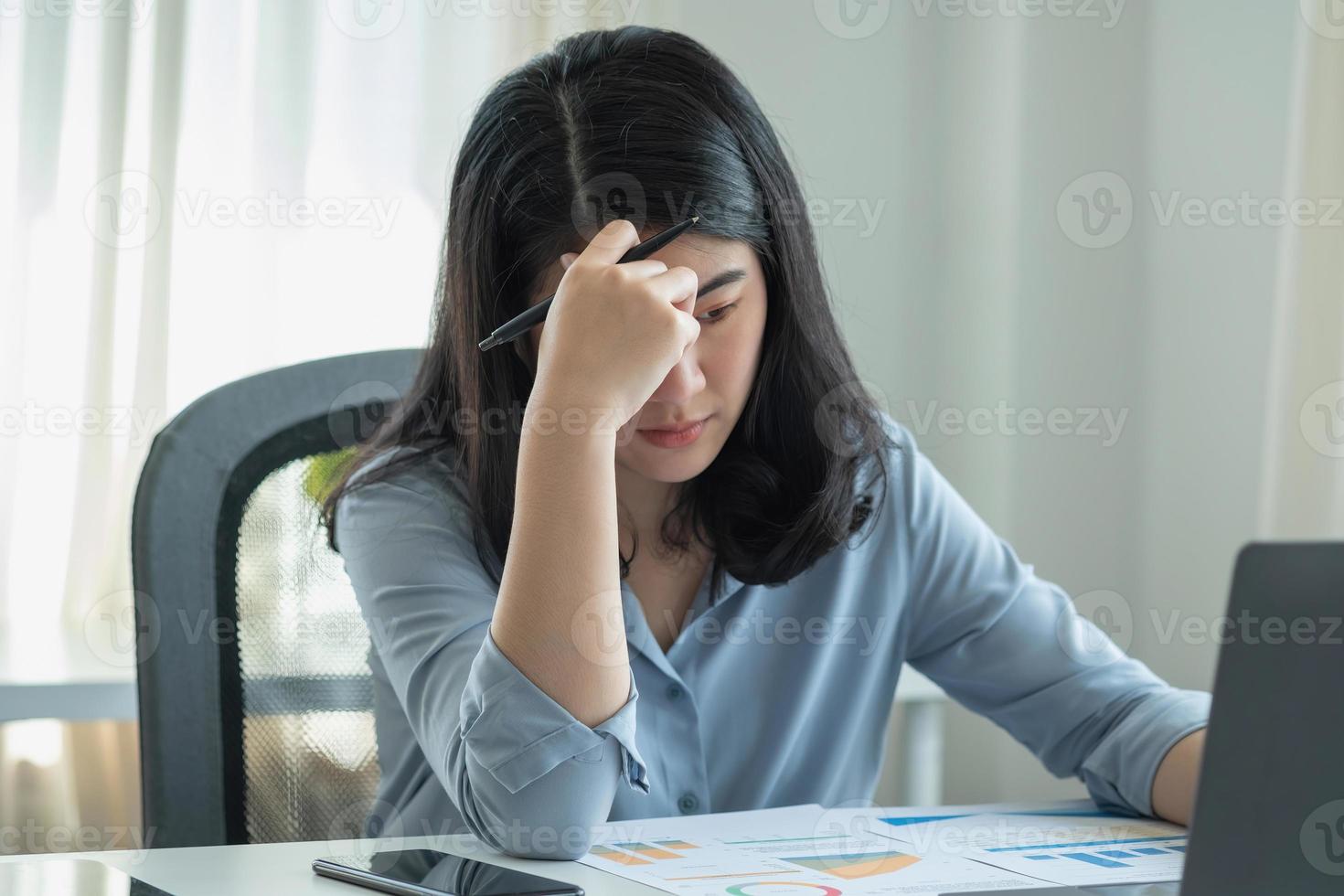Concept Burnout Syndrome. Business Woman feels uncomfortable working. Which is caused by stress, accumulated from unsuccessful work And less resting body. Consult a specialist psychiatrist. photo