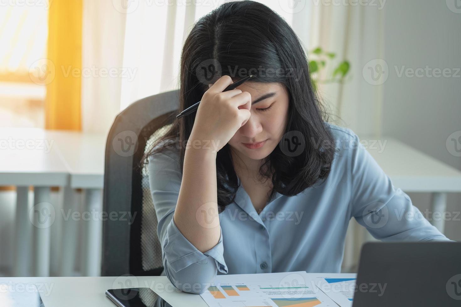Concept Burnout Syndrome. Business Woman feels uncomfortable working. Which is caused by stress, accumulated from unsuccessful work And less resting body. Consult a specialist psychiatrist. photo