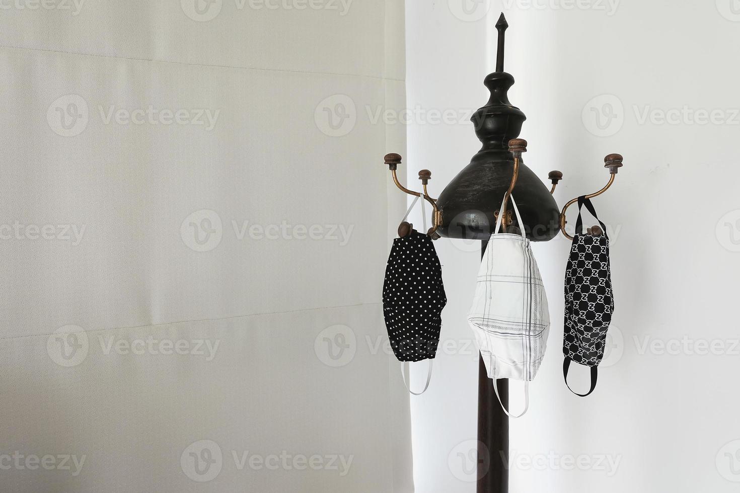 handmade clothes face masks hanging on clothes line after washed. Face mask is be come necessary for life this day due to Covid-19. And be come rare item. So, people made own clothes face mask. photo