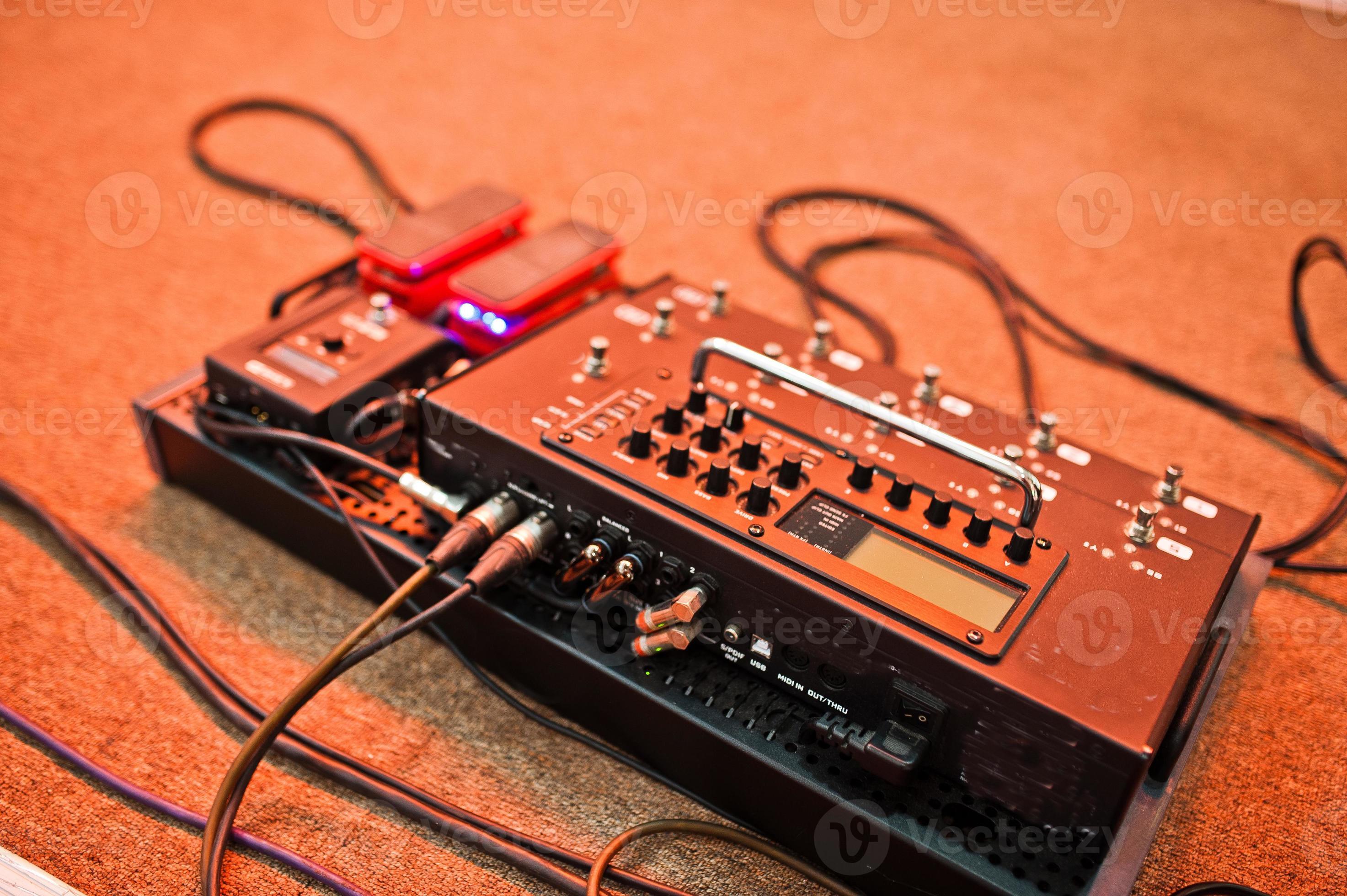 Effects unit with pedals and compressors for guitar legs. 10380396