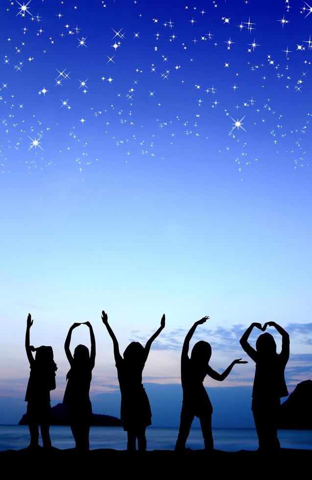 Silhouette of young woman with stars photo