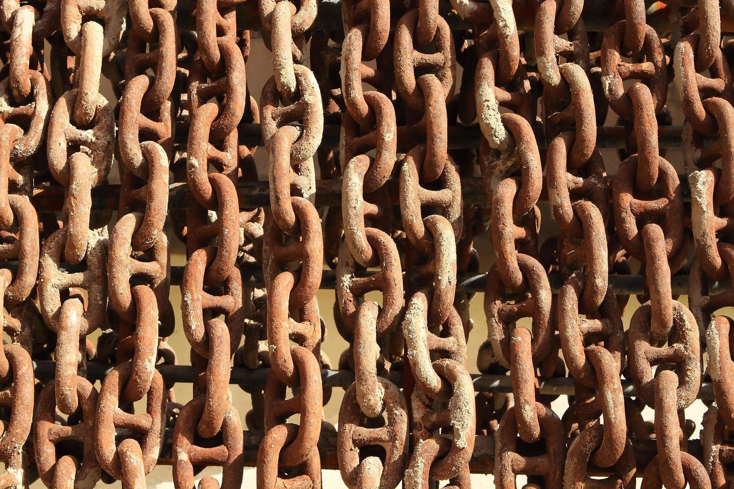 Old rusty ship anchor chain links close up. photo