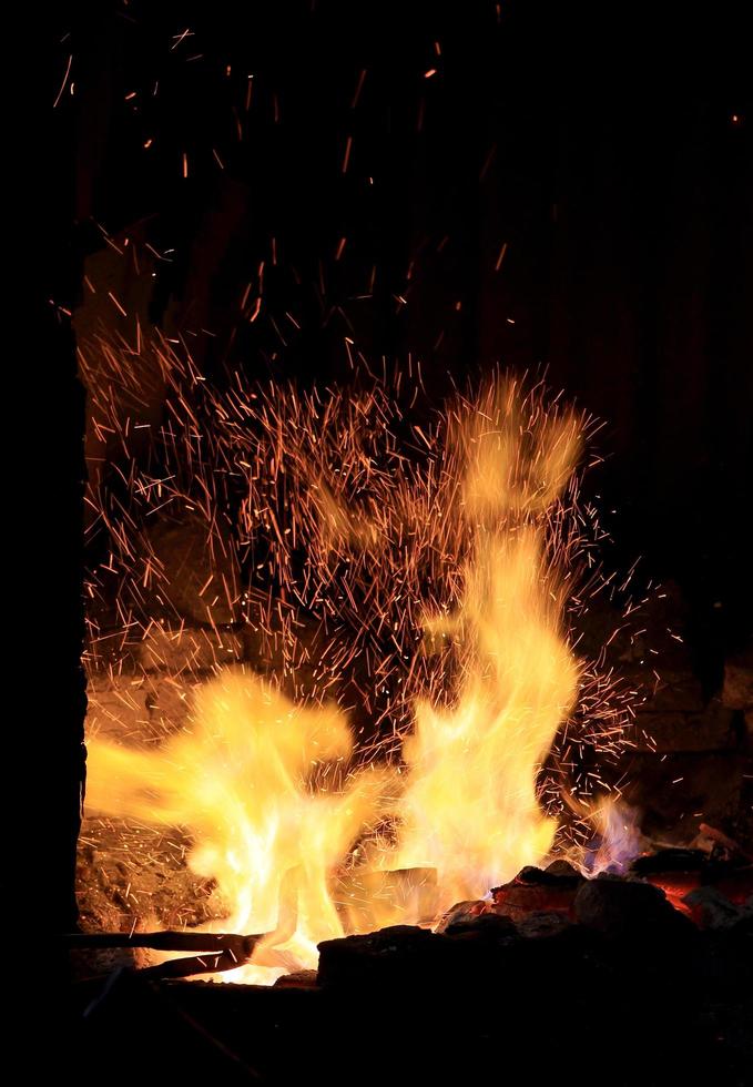 forge fire in blacksmith's where iron tools are crafted photo