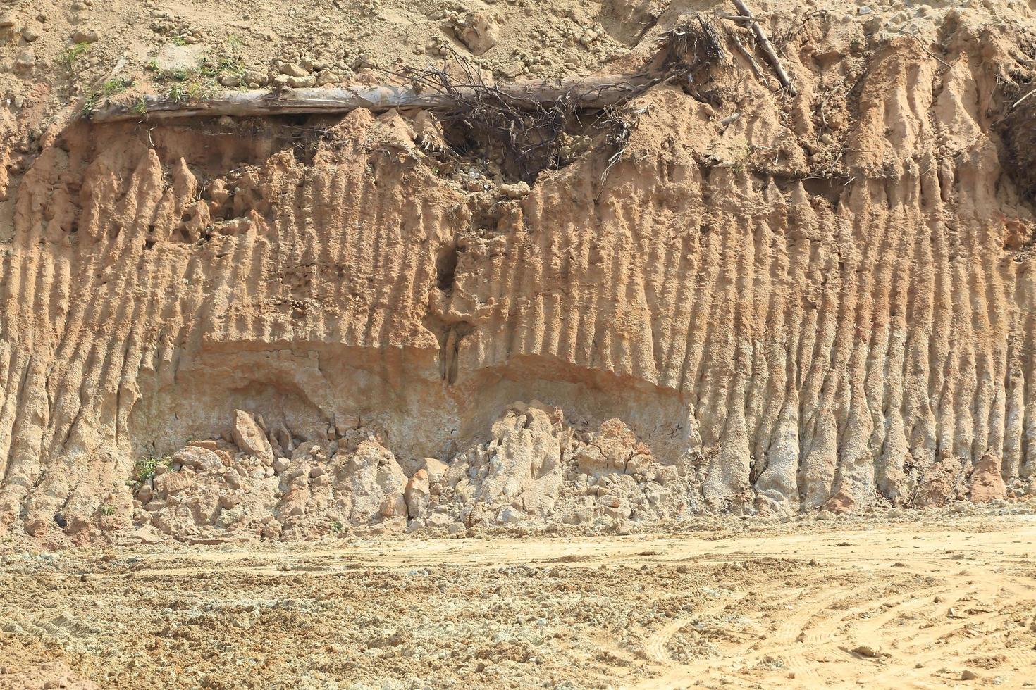 Broken road. Beneath the asphalt. Layer of soil beneath the asphalt road photo