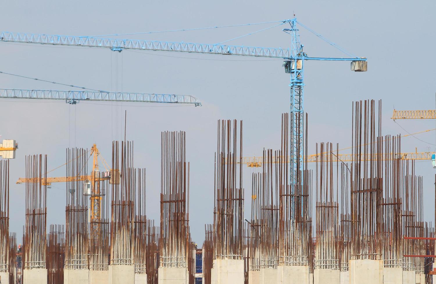 Construction site with enforced concrete steel frames rising up photo