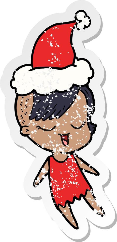 happy distressed sticker cartoon of a girl wearing santa hat vector