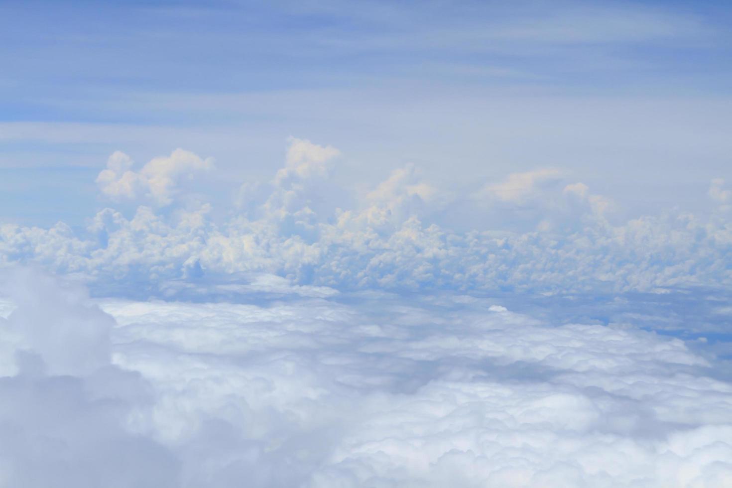 Airplane above clouds photo