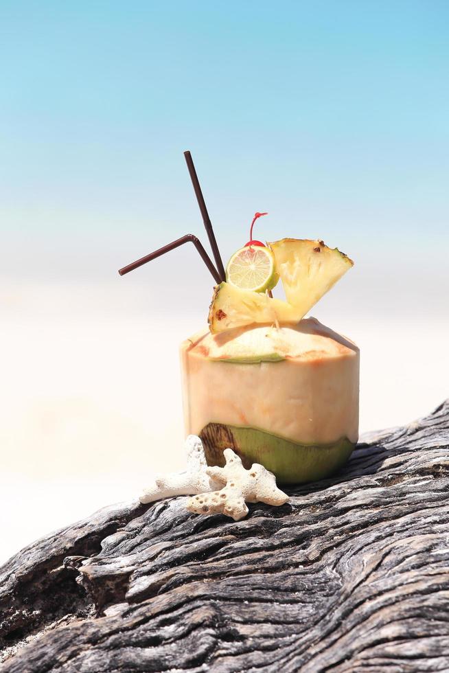 Coconut cocktail on the beach photo