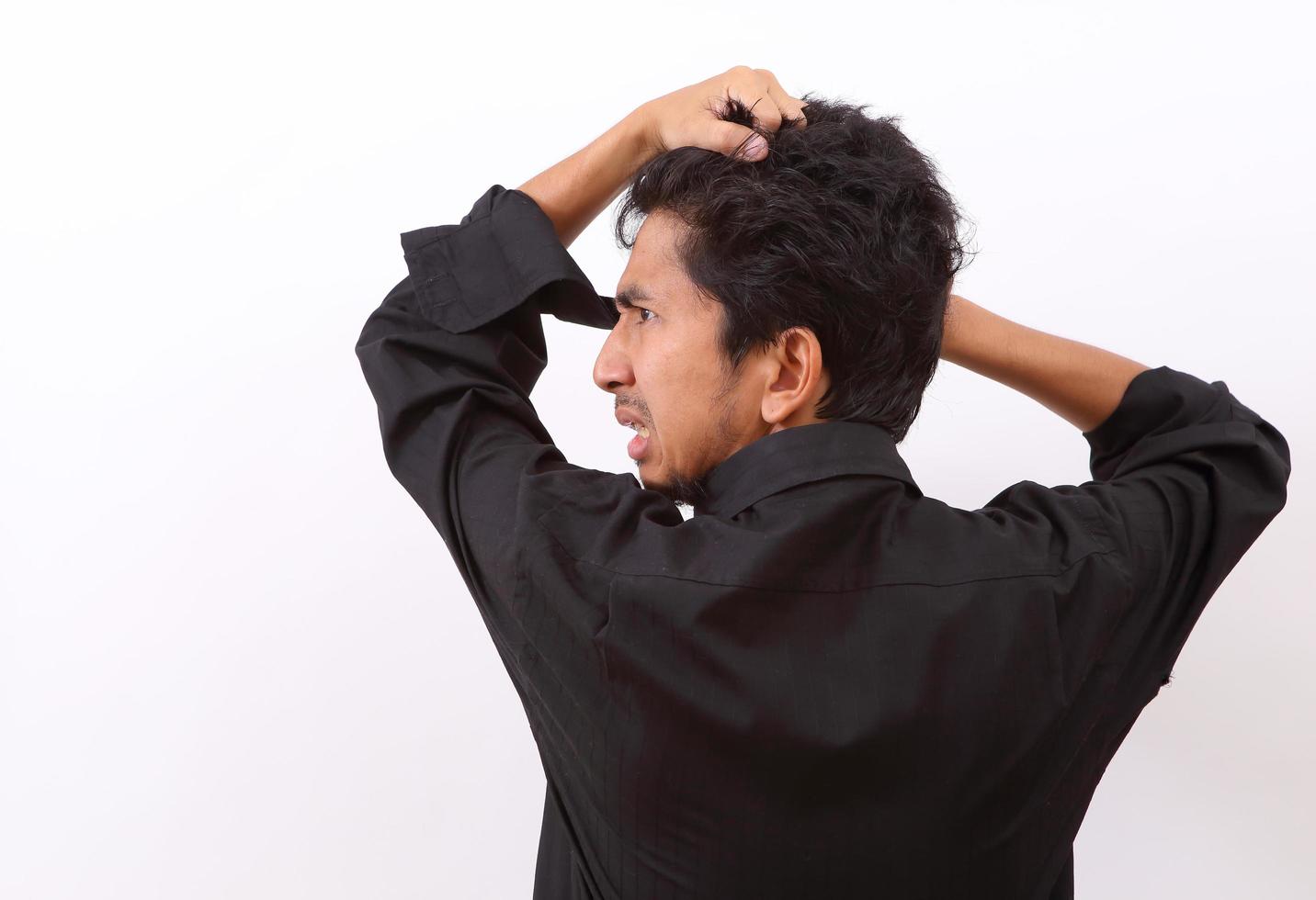 businessman angry and shouting over isolated white background photo