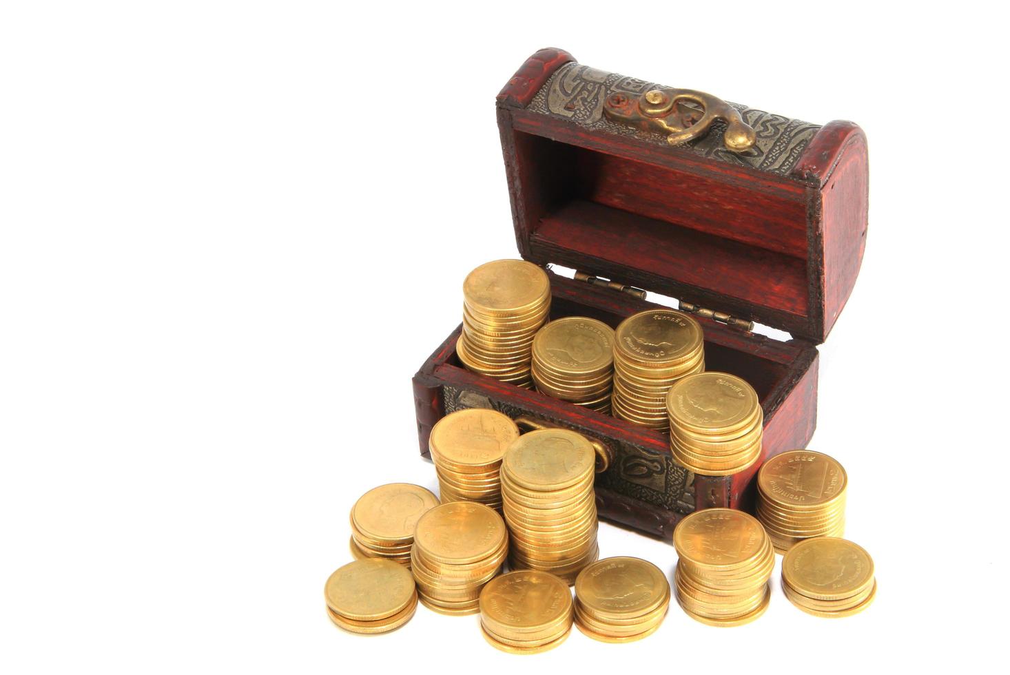 A wooden ancient chest full of money photo