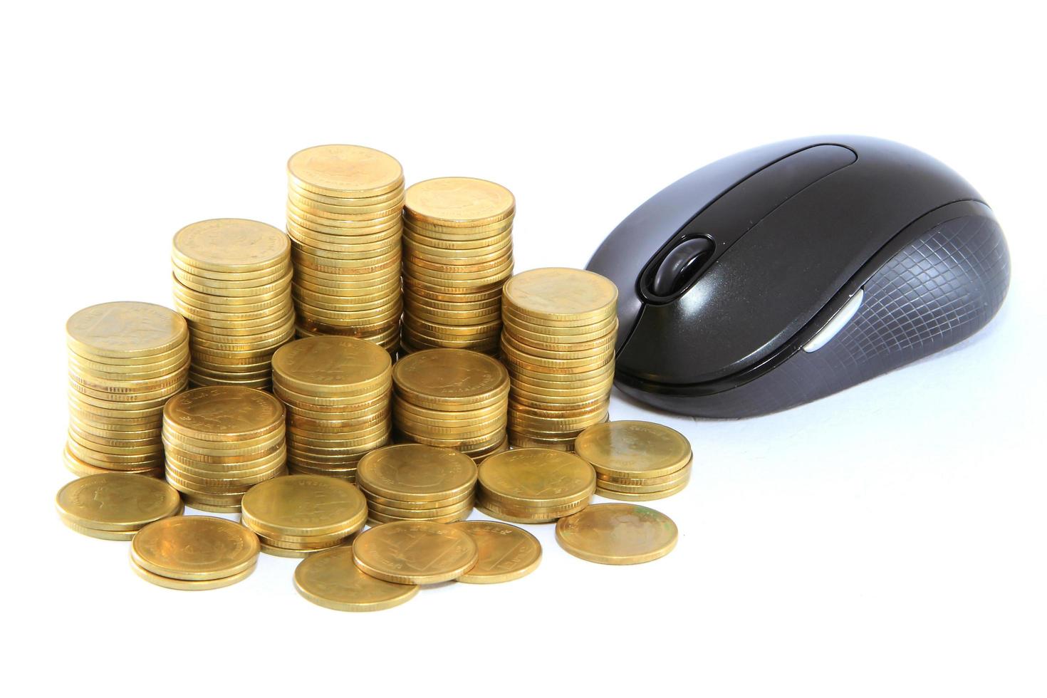 black  computer mouse and golden coin photo