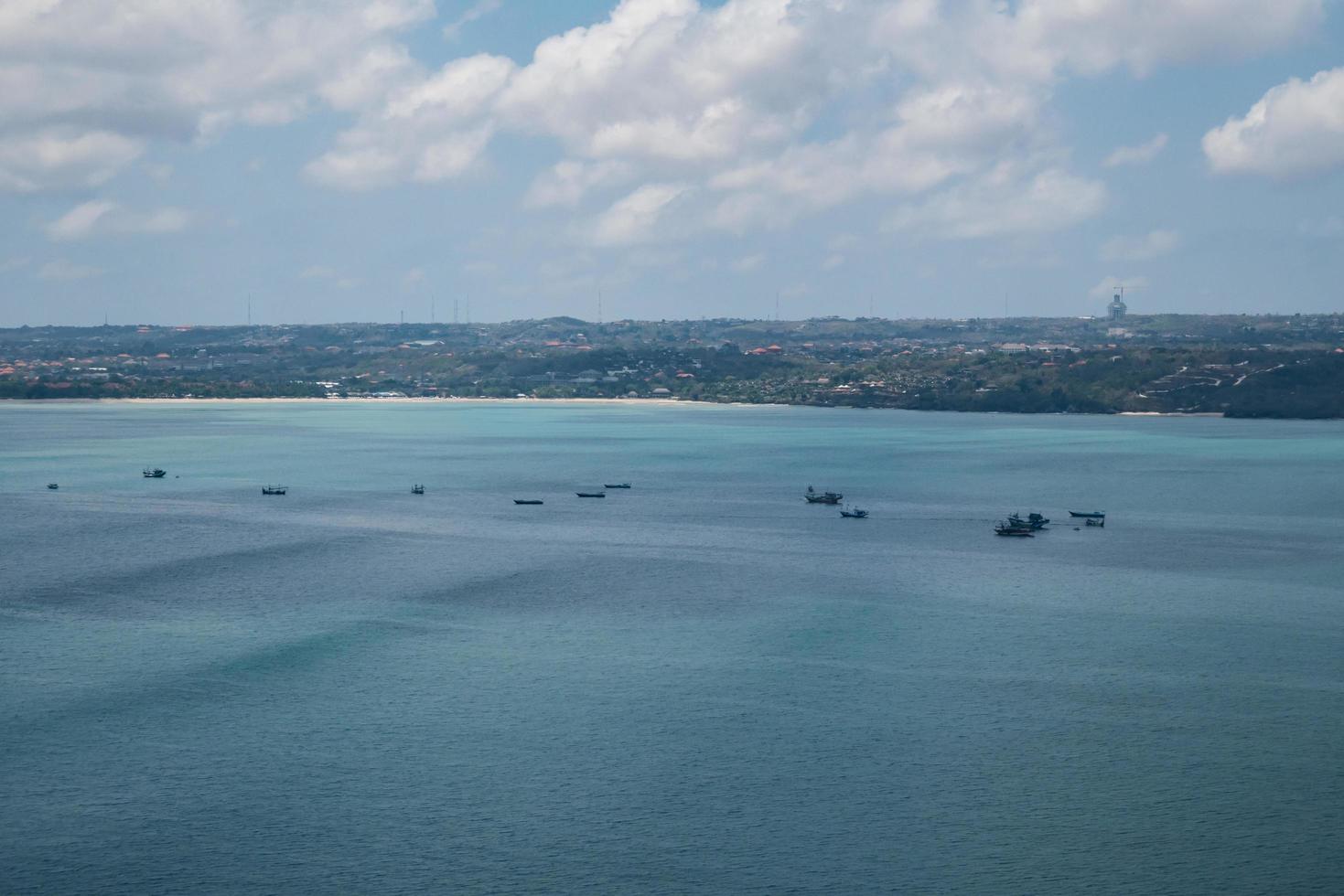 Bali island in tropical sea, veiw from airplane sight photo