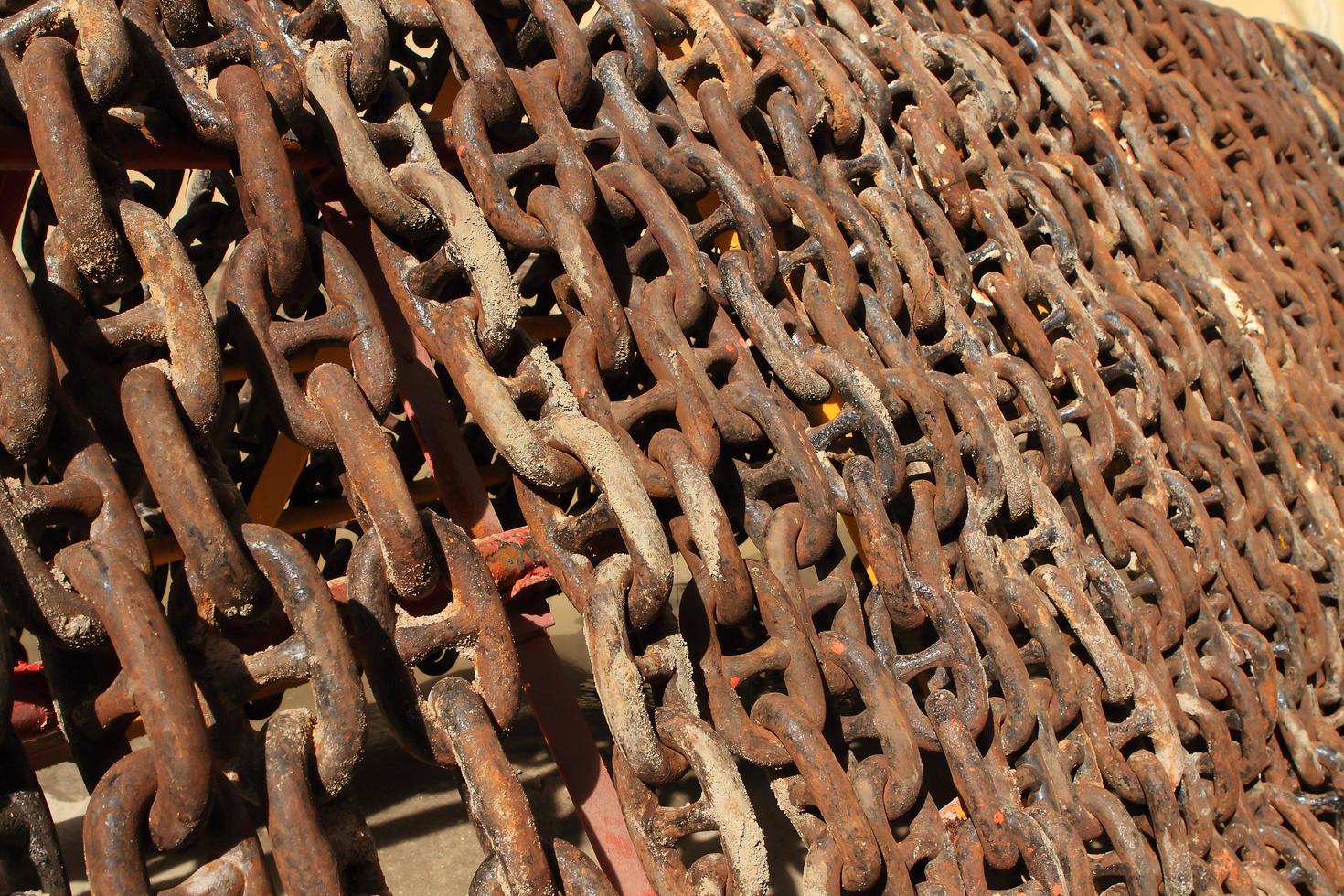 Old rusty ship anchor chain links close up. photo