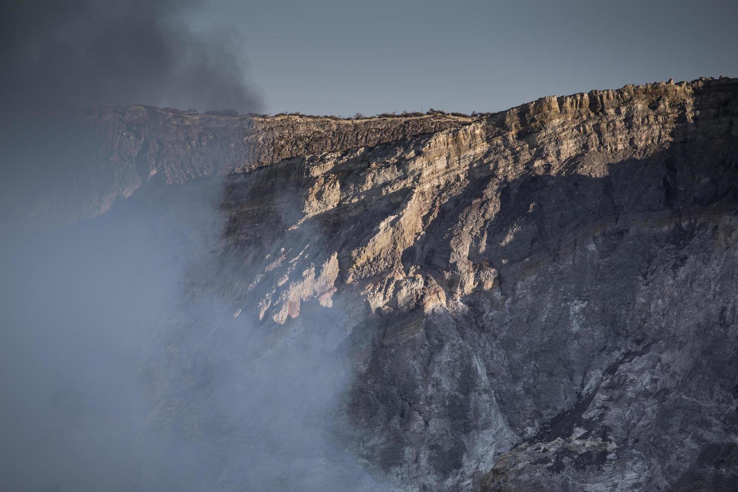 Sulfur mine with workers in Kawah Ijen, Java, Indonesia photo