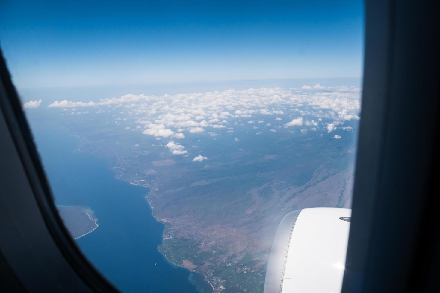Bali island in tropical sea, veiw from airplane sight photo