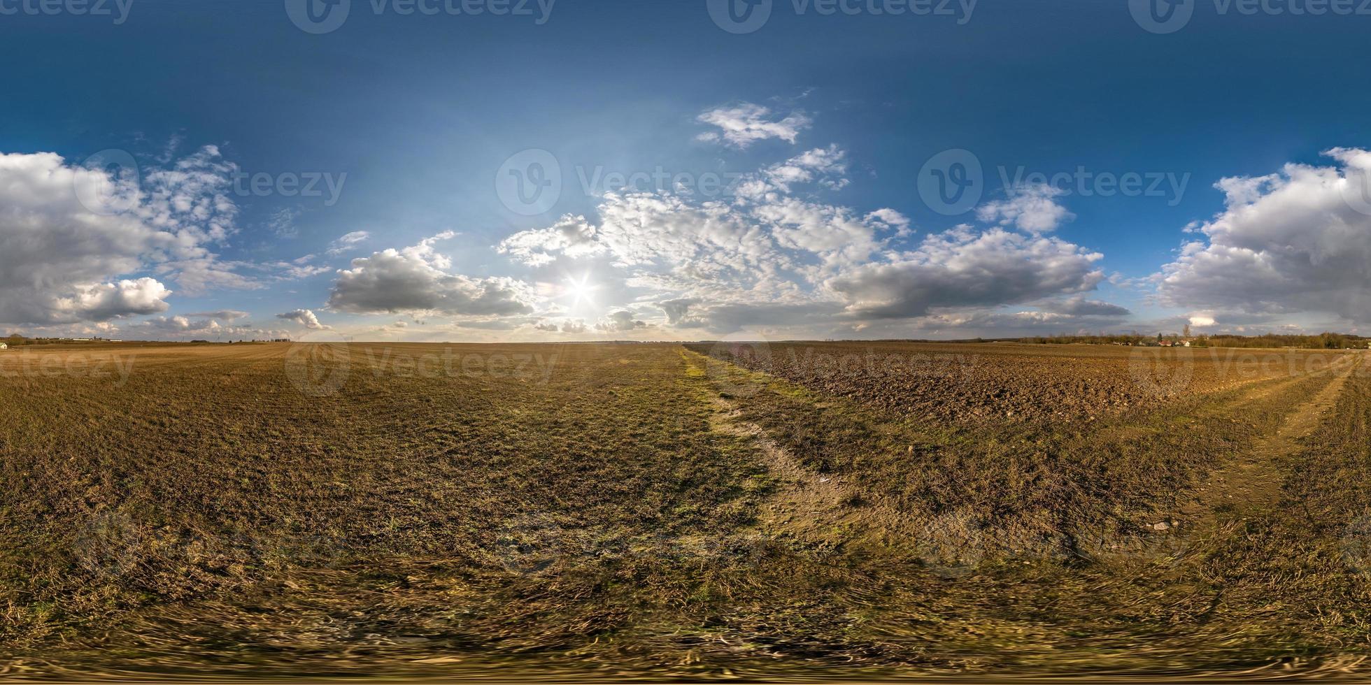 full seamless spherical hdri panorama 360 degrees angle view on among fields in spring day with awesome clouds in equirectangular projection, ready for VR AR virtual reality content photo