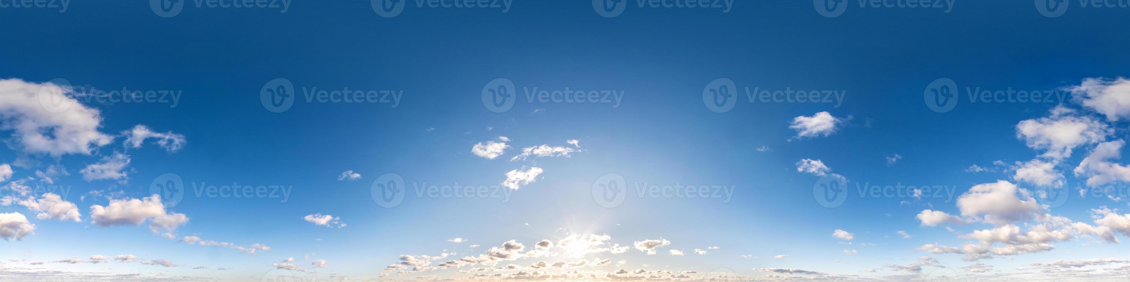 Seamless hdri panorama 360 degrees angle view blue sky with beautiful fluffy cumulus clouds with zenith for use in 3d graphics or game development as sky dome or edit drone shot photo