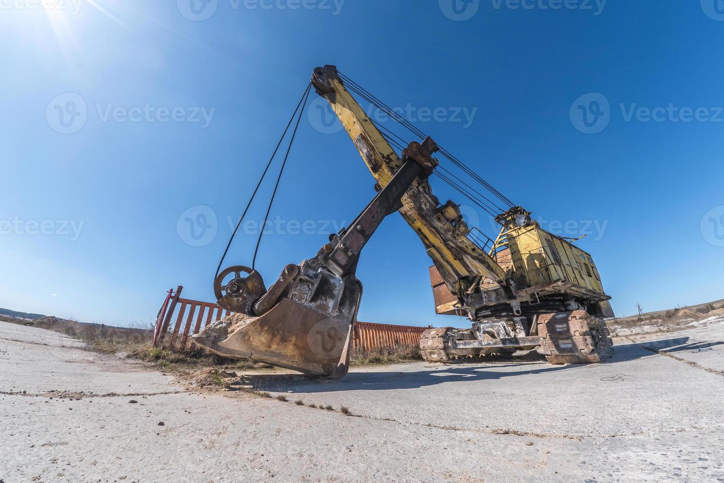 huge old rusty abandoned mining excavator photo