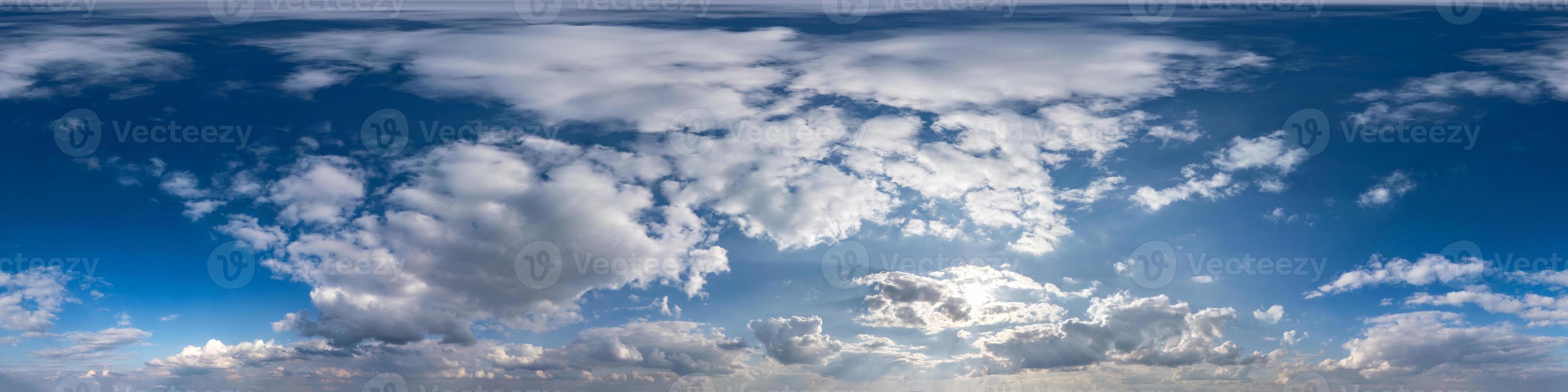 Seamless hdri panorama 360 degrees angle view blue sky with beautiful fluffy cumulus clouds with zenith for use in 3d graphics or game development as sky dome or edit drone shot photo