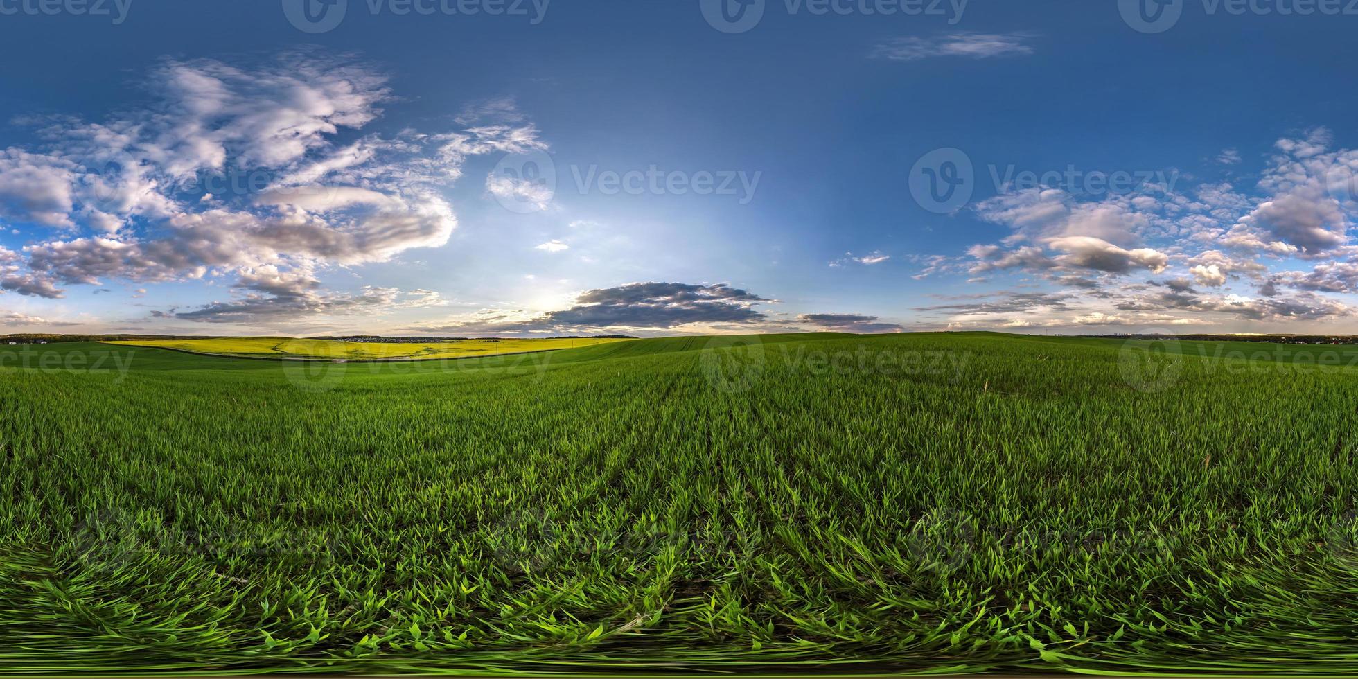 full seamless spherical hdri panorama 360 degrees angle view on among fields in spring evening with awesome clouds in equirectangular projection, ready for VR AR virtual reality content photo