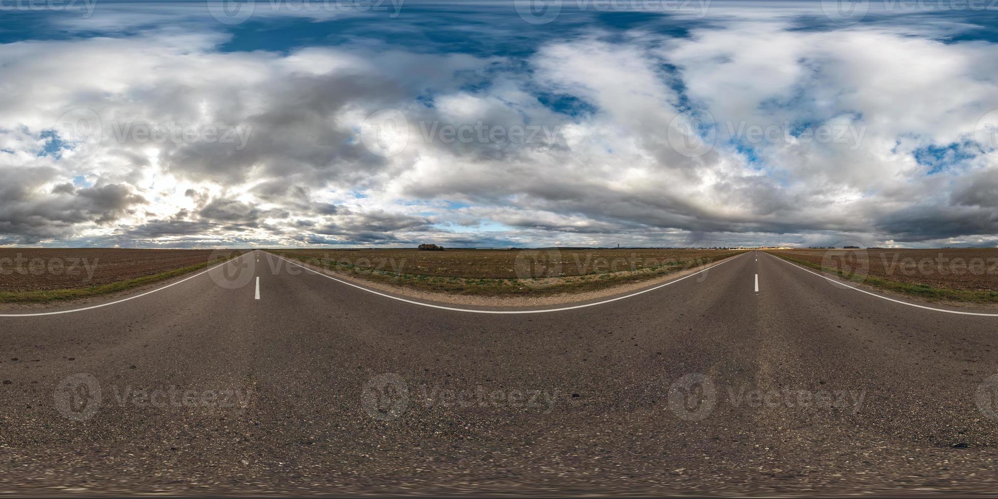 full seamless spherical hdri panorama 360 degrees angle view on asphalt road among fields in autumn day with beautiful clouds in equirectangular projection, ready for VR AR virtual reality content photo