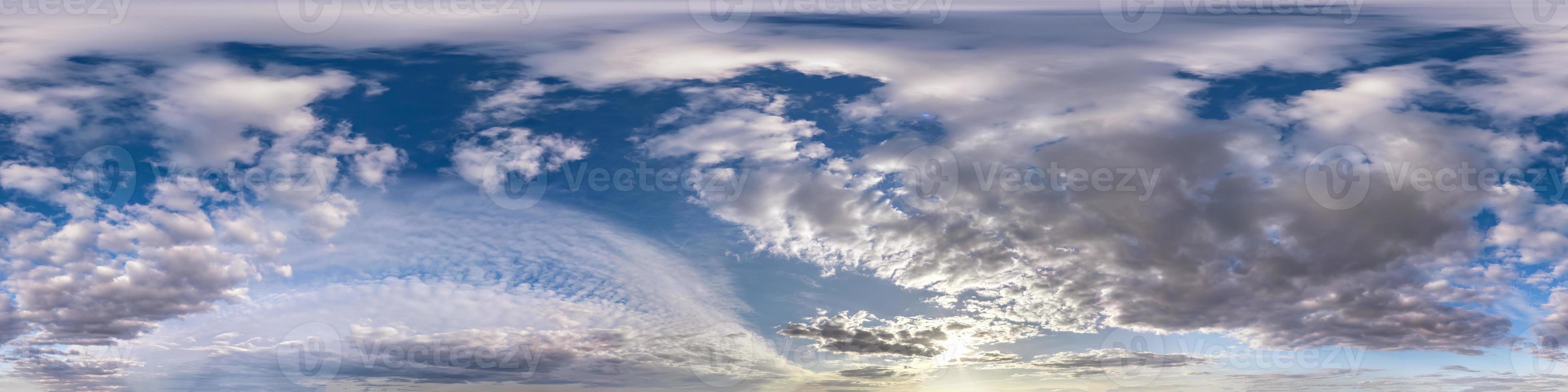 Seamless hdri panorama 360 degrees angle view blue sky with beautiful evening fluffy cumulus clouds without ground with zenith for use in 3d graphics or game development as sky dome or edit drone shot photo
