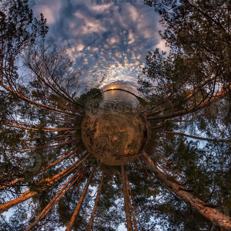 Little planet transformation of spherical panorama 360 degrees. Spherical abstract aerial view in field with awesome beautiful clouds. Curvature of space. photo