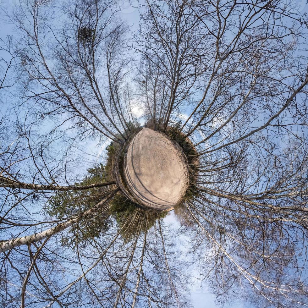 Little planet transformation of spherical panorama 360 degrees. Spherical abstract aerial view in field with awesome beautiful clouds. Curvature of space. photo