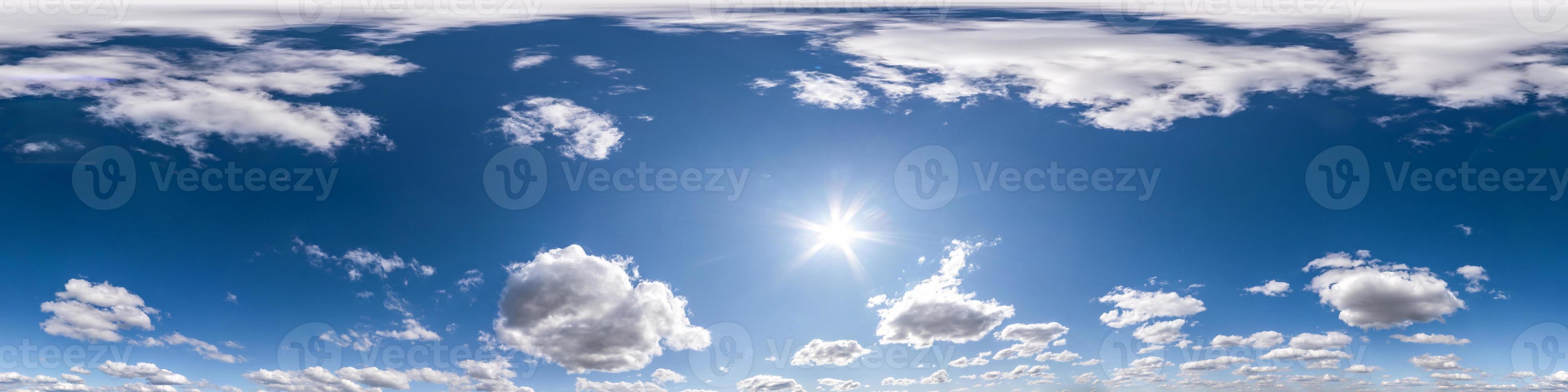 blue sky with beautiful fluffy cumulus clouds. Seamless hdri panorama 360 degrees angle view without ground for use in 3d graphics or game development as sky dome or edit drone shot photo