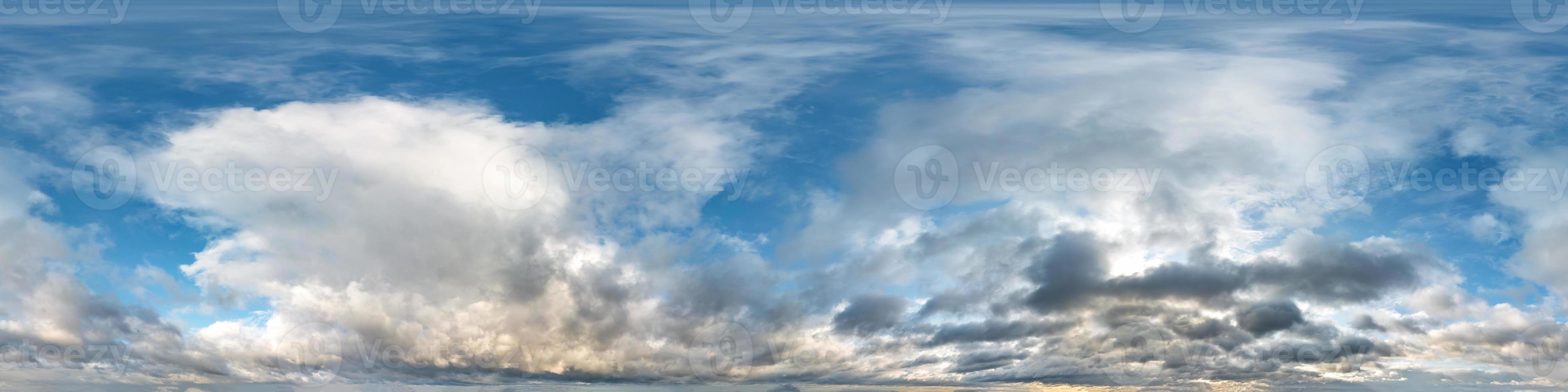 blue sky with beautiful evening cumulus clouds. Seamless hdri panorama 360 degrees angle view with zenith for use in graphics or game development as sky dome or edit drone shot photo