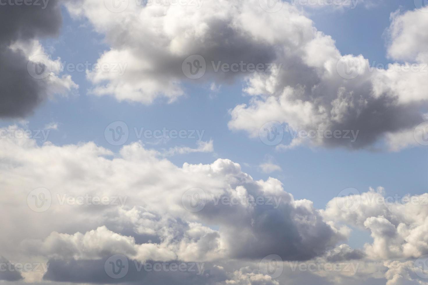 Blue sky background with tiny stratus cirrus striped clouds. Clearing day and Good windy weather photo