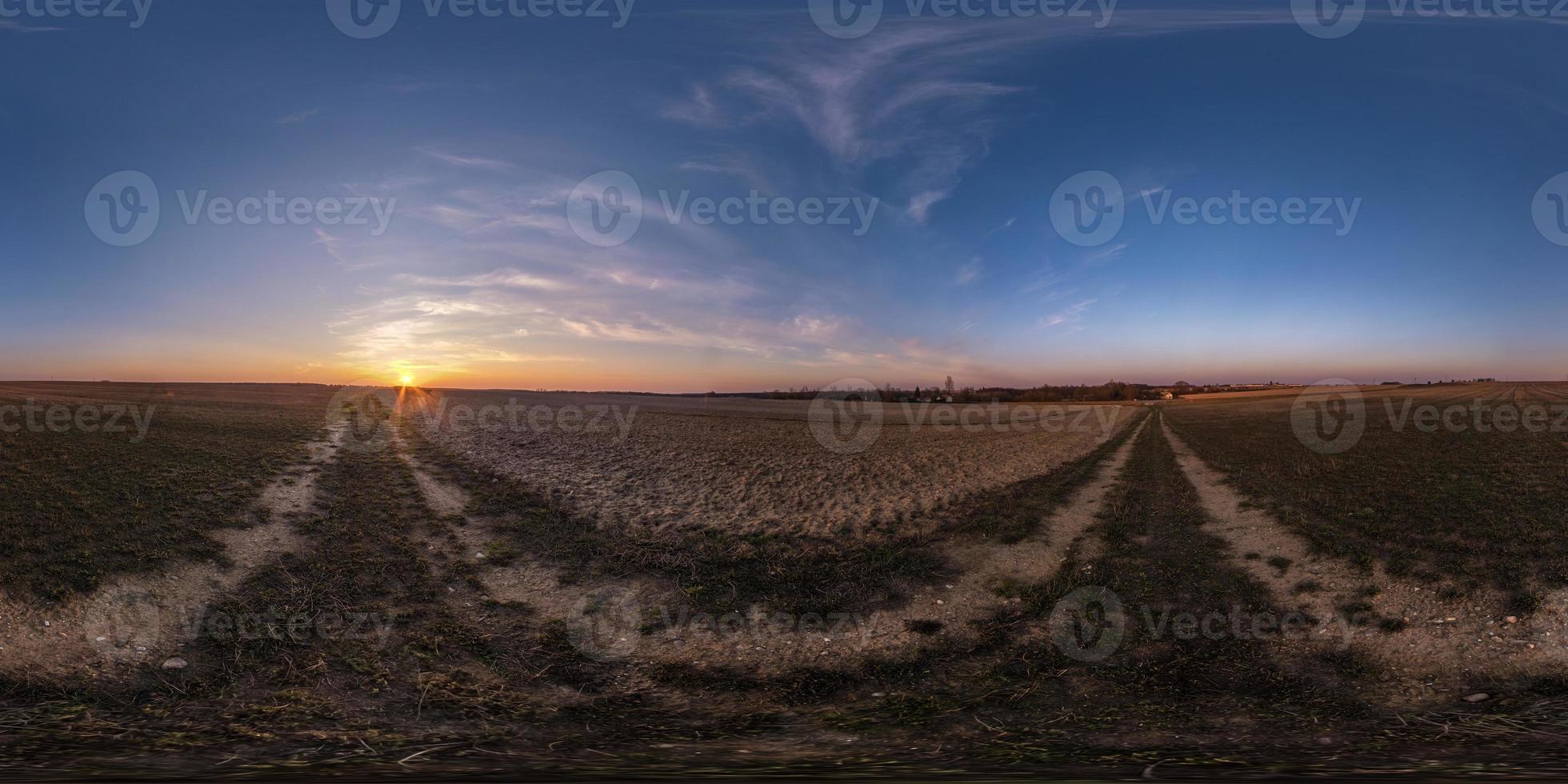 full seamless spherical hdri panorama 360 degrees angle view among fields in evening sunset with awesome blue pink red clouds in equirectangular projection, ready for VR AR virtual reality photo