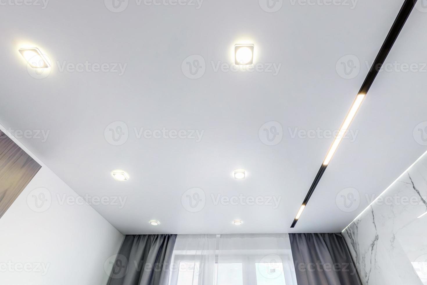 suspended ceiling with halogen spots lamps and drywall construction in ...