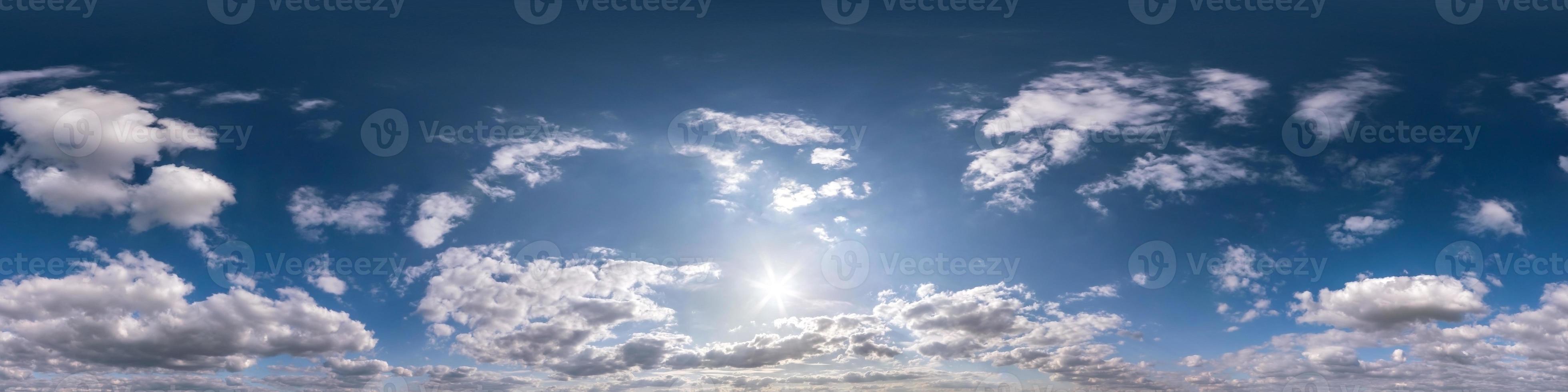 blue sky with beautiful fluffy cumulus clouds without ground. Seamless hdri panorama 360 degrees angle view without ground for use in 3d graphics or game development as sky dome or edit drone shot photo