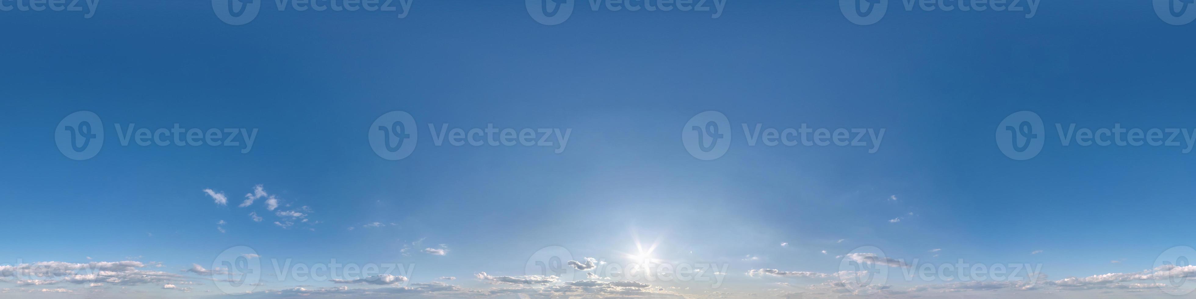 blue sky with beautiful fluffy cumulus clouds. Seamless hdri panorama 360 degrees angle view without ground for use in 3d graphics or game development as sky dome or edit drone shot photo