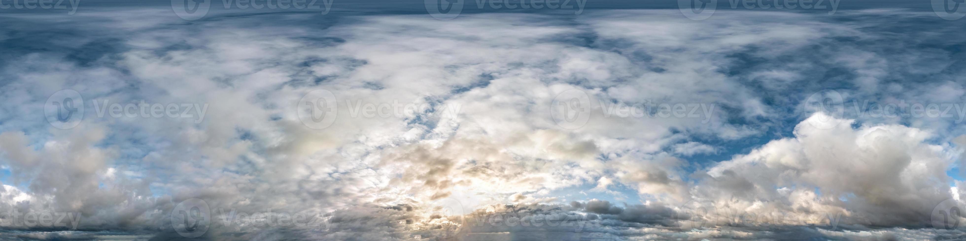 blue sky with beautiful evening cumulus clouds. Seamless hdri panorama 360 degrees angle view with zenith for use in 3d graphics or game development as sky dome or edit drone shot photo